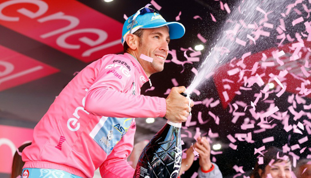 Vincenzo Nibali celebrates the pink jersey on the podium of the 20th stage of the Giro d'Italia.